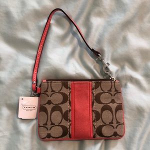 NWT Coach wristlet peach and classic print